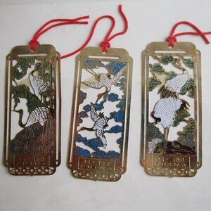 set of enameled golden miniature bookmarks